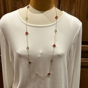 NWOT Gold necklace with red stones and clear rhinestones.